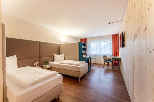 Katil atau katil-katil dalam bilik di Apartments Kehl - Boardinghouse und Ferienwohnungen in Sundheim