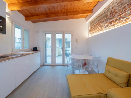 a living room with a couch and a table at Luxury apartment - Flumendosa 5 in Milan