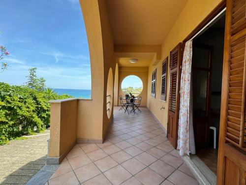 a balcony of a house with a view of the ocean at Casa Archi in Cefalù