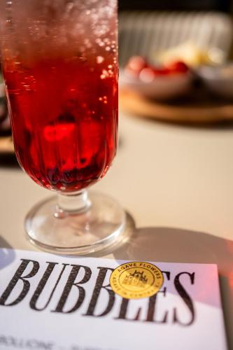 a drink in a glass sitting on top of a table at Agave in Centrale in Milan