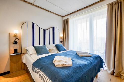 Voodi või voodid majutusasutuse Loft Premium Apartments by Baltic Home toas