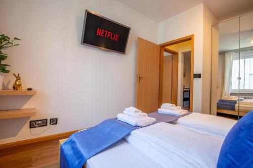 a room with a bed with a sign on the wall at Special ROGER F RABBIT 2 Apartment, Roche Towers, 10-STAR in Basel