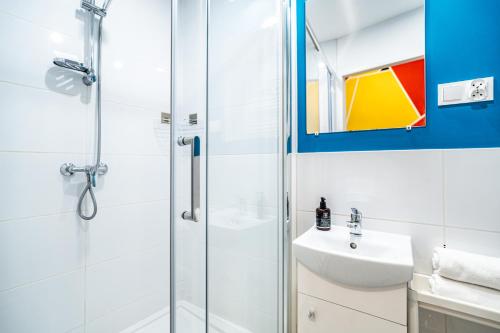 a bathroom with a shower and a sink at ShortStayPoland Old Town C1 in Kraków