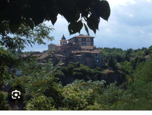 a large building on top of a hill at Casa bolsena in Gradoli