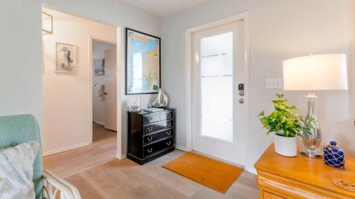a living room with a dresser and a mirror at RSL2472 Punta Gorda Isles in Punta Gorda