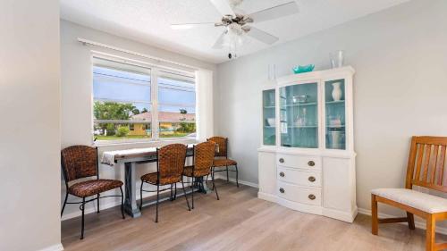 a dining room with a table and chairs and a ceiling fan at RSL2472 Punta Gorda Isles in Punta Gorda