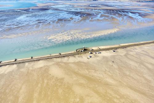 an aerial view of the beach and the ocean at Le Parc des Mimosas in Noirmoutier-en-l'lle
