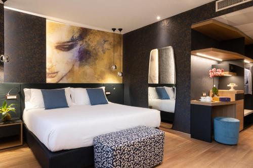 a bedroom with a bed and a painting on the wall at San Severino Park Hotel & SPA, BW Signature Collection in Mercato San Severino