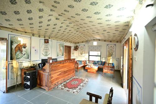 a living room with a coffered ceiling at The castle crown - Hem Vilas Resort Ranthambhore in Sawāi Mādhopur