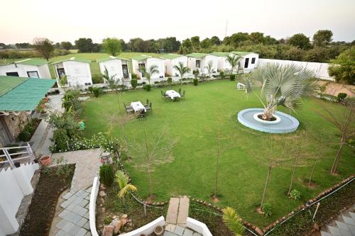 an aerial view of a large yard with a park at The castle crown - Hem Vilas Resort Ranthambhore in Sawāi Mādhopur