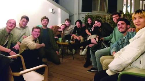a group of people sitting in a living room at Tric Trac Hostel in Naples
