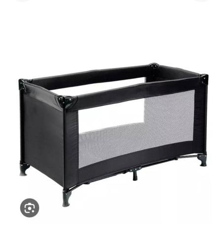 a black metal bed frame with a window at EchoBay nr 2 - child-friendly house close to the beach in Jerup
