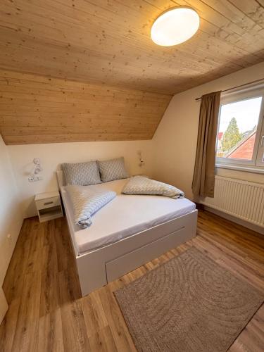 a bedroom with a bed in a room at Nachtigal's Ore Mountains Residence in Kovářská