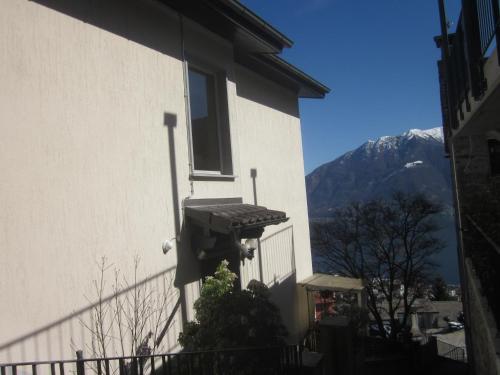 a building with a grill on the side of it at Casa Franceschini in Locarno