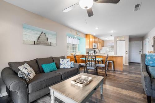 a living room with a couch and a table at Lakeside Laziness 28-4 By SDC, Big Deck, Pool, Hot Tub, Pets Ok, Resort On Lake in Branson