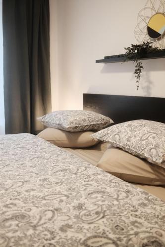 two beds with pillows on them in a bedroom at Félix le chat ll in La Roche-en-Ardenne