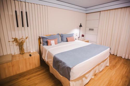 Ein Bett oder Betten in einem Zimmer der Unterkunft Mercure Camboriu