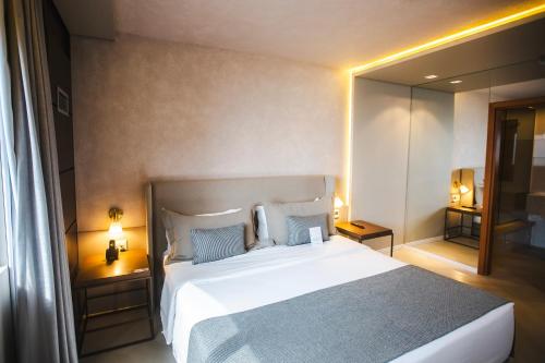 Ein Bett oder Betten in einem Zimmer der Unterkunft Mercure Camboriu