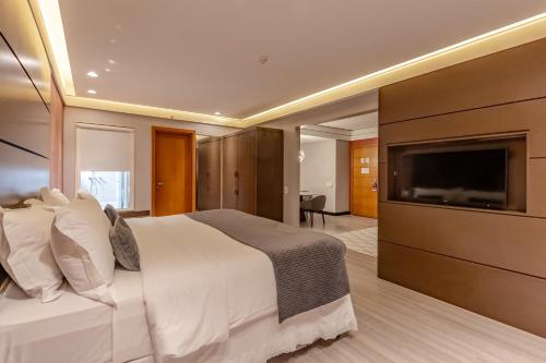 Ein Bett oder Betten in einem Zimmer der Unterkunft Mercure Camboriu