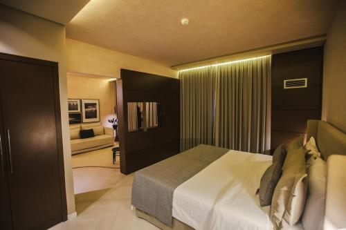 Ein Bett oder Betten in einem Zimmer der Unterkunft Mercure Camboriu