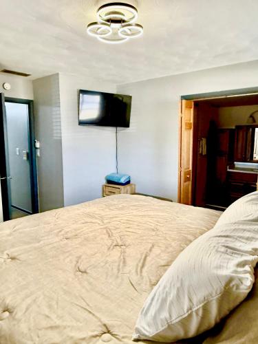 Katil atau katil-katil dalam bilik di Delightful 3 Bedroom Home