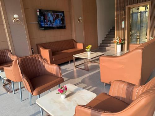 Zona de estar de Hotel Pruthvi Executive, Pune