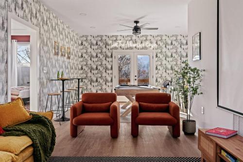 a living room with two chairs and a table at Wildview Retreat in Lake Lure
