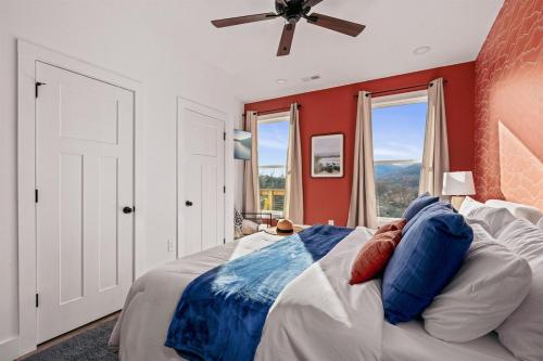 a bedroom with a bed and a ceiling fan at Wildview Retreat in Lake Lure