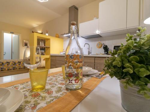a glass bottle sitting on a table in a kitchen at Casa Lisander in Lecco