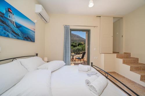 Cama o camas de una habitación en Triodos Villa Myrtos