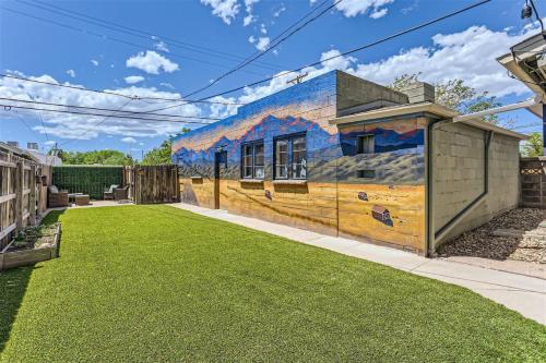 a house with a mural on the side of it at At S. Broadway An Artsy Bungalow Close to DU And Cherry Hills in Englewood