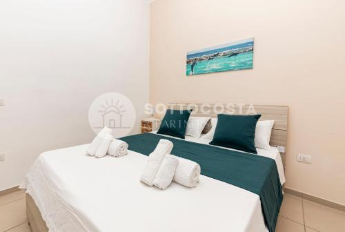 Кровать или кровати в номере La Torre Apartments