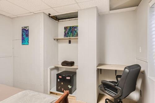 a bedroom with a desk and a chair in a room at Pet Friendly Townhome WIth A Fireplace And A King Bed In Littleton in Littleton