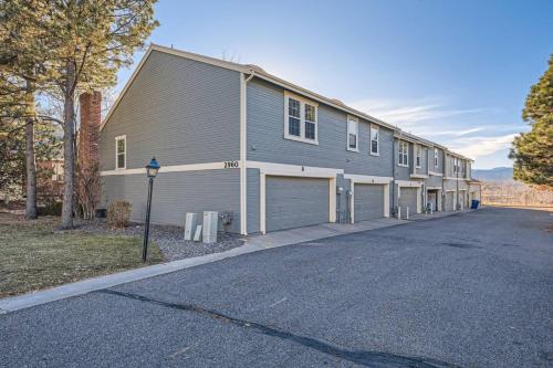 a large building with a garage on a street at Pet Friendly Townhome WIth A Fireplace And A King Bed In Littleton in Littleton