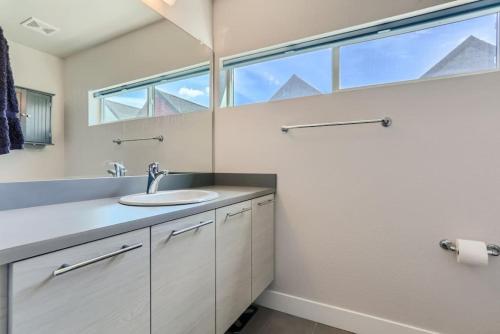 a bathroom with a sink and a large window at 3 Bedrooms 2 Bath Townhome In West Denver Near to Red Rocks And Foothills in Lakewood