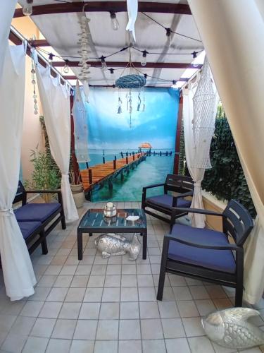 a patio with a view of the water at Silvi d'aMare in Silvi Marina