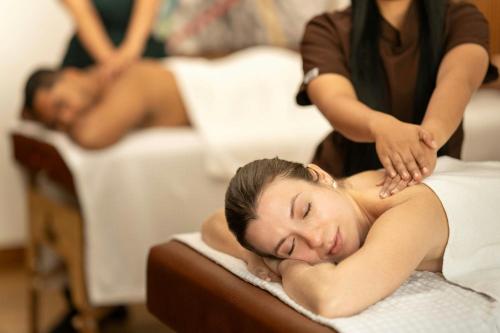 a woman getting a massage at a spa at Barranquilla Marriott Hotel in Barranquilla