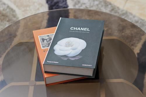 two books sitting on top of a glass table at Best Lifestyle Home hippodrome in Yaoundé