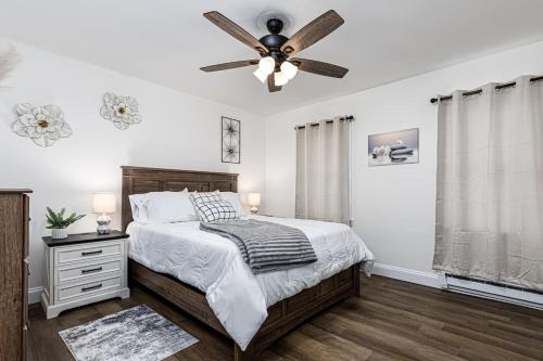 a bedroom with a bed and a ceiling fan at Serenity Inn in Ronks