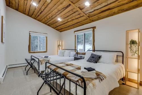 a bedroom with two beds and a couch at Mountain Mansion With A Hot Tub And A Sauna in Morrison