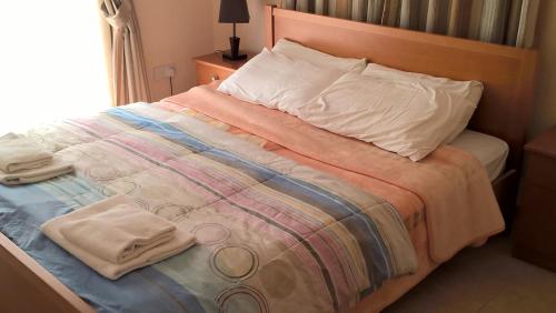 A bed or beds in a room at Kapsalia Holiday Villas