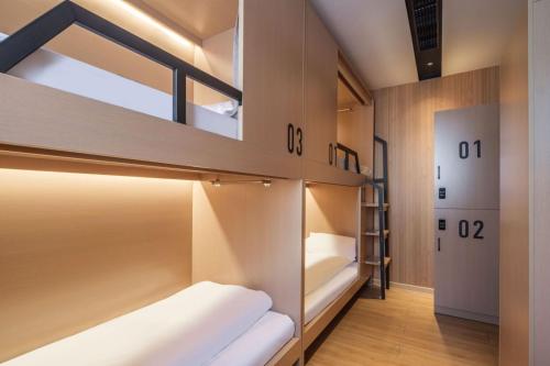 Captain 5 Youth Hotel-Shanghai Laoshan Road Branchにあるベッド