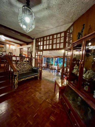 a living room with a couch and a table at Hotel La Mansion del Sol in Guadalajara