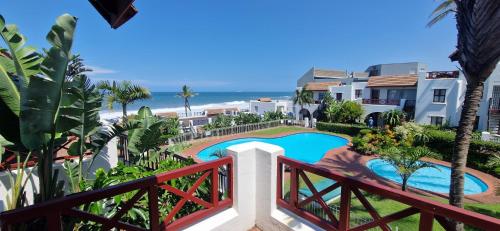 a view of a pool from the balcony of a resort at 26 Le Paradis in Ballito