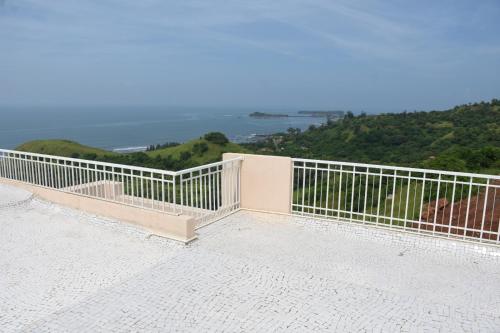 a balcony with a view of the ocean at Nikhat villa 61 in Harnai