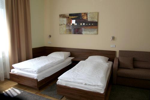 Ένα ή περισσότερα κρεβάτια σε δωμάτιο στο Hotel am Charlottenplatz