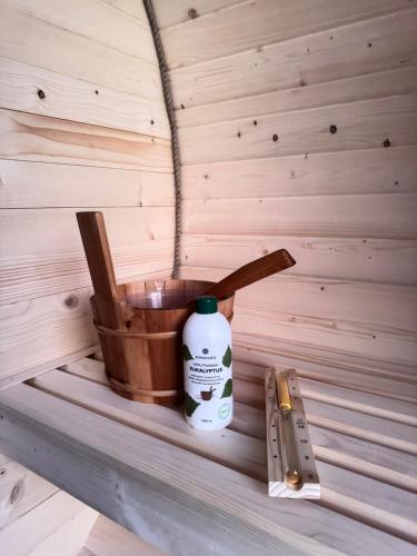 a bottle of detergent sitting on a shelf in a sauna at Pokoje u Hani - sauna, balia z hydromasażem in Bukowina Tatrzańska