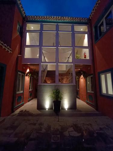 a large window of a building with a potted plant at LorPalma in Los Sauces
