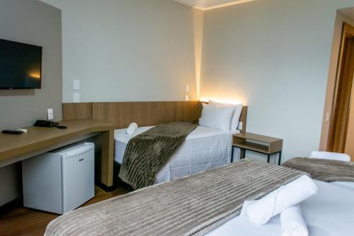 TV a/nebo společenská místnost v ubytování Hotel Évora by Rede Sagres
