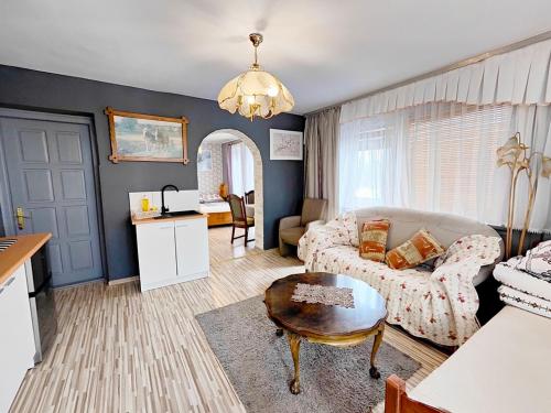 a living room with a couch and a table at U Dany in Białka Tatrzanska